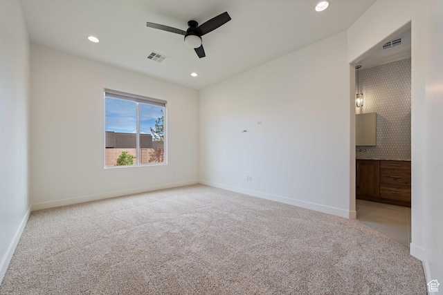 unfurnished bedroom featuring light colored carpet, visible vents, and recessed lighting