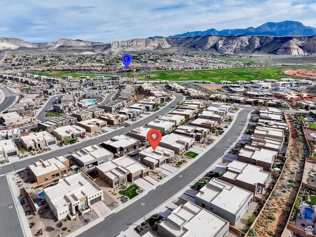 drone / aerial view with a residential view and a mountain view
