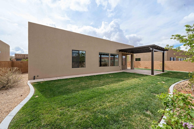 rear view of property featuring stucco siding, a pergola, fence, and a patio area