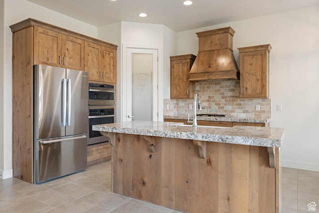 kitchen featuring decorative backsplash, stainless steel appliances, custom range hood, baseboards, and recessed lighting