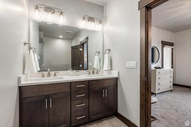 1166 W Cadence Ct, Kamas, UT 84036 - bathroom featuring baseboards, visible vents, a sink, and double vanity