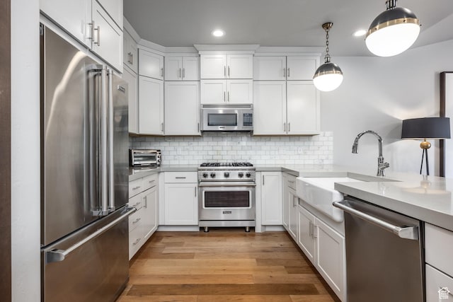 1166 W Cadence Ct, Kamas, UT 84036 - kitchen featuring recessed lighting, white cabinets, premium appliances, and a sink