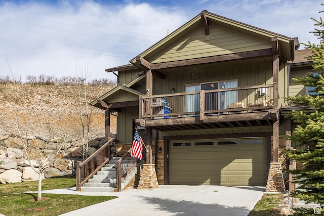 1166 W Cadence Ct, Kamas, UT 84036 - view of front of property with a balcony, concrete driveway, stone siding, board and batten siding, and a garage