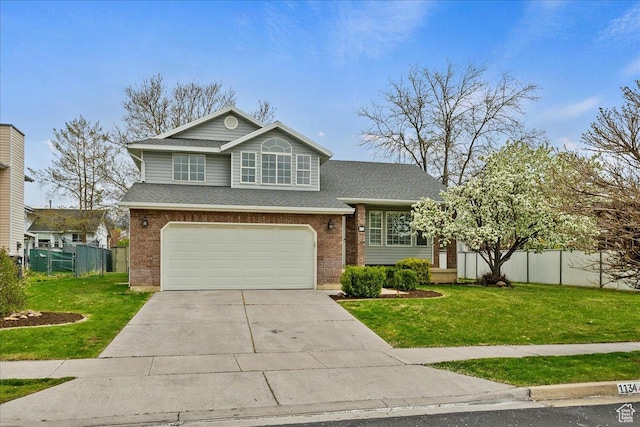view of front of property featuring a garage, driveway, a front yard, and fence
