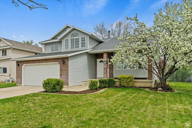 view of front of property with fence, a front lawn, brick siding, and concrete driveway
