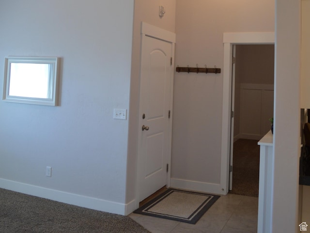 1921 N Crest Rd, Saratoga Springs, UT 84045 - entryway with baseboards, light carpet, and light tile patterned flooring