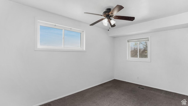 22 W La Vista Dr S, West Jordan, UT 84088 - unfurnished room featuring dark carpet, a ceiling fan, a healthy amount of sunlight, and visible vents