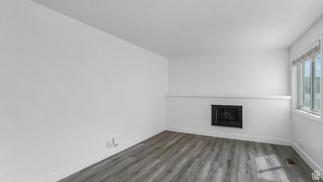22 W La Vista Dr S, West Jordan, UT 84088 - spare room featuring baseboards, wood finished floors, visible vents, and a fireplace