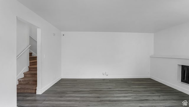 22 W La Vista Dr S, West Jordan, UT 84088 - unfurnished living room with baseboards, wood finished floors, and stairs