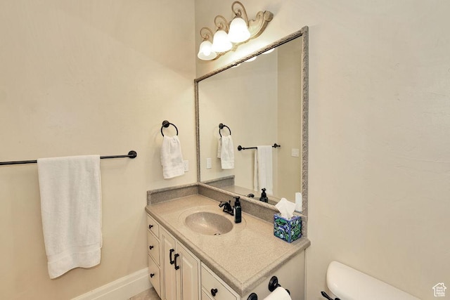 943 N Terrace Dr, Provo, UT 84604 - half bathroom featuring toilet, vanity, and baseboards