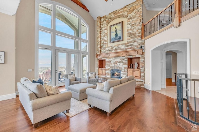 943 N Terrace Dr, Provo, UT 84604 - living room with wood finished floors, a healthy amount of sunlight, a towering ceiling, and baseboards