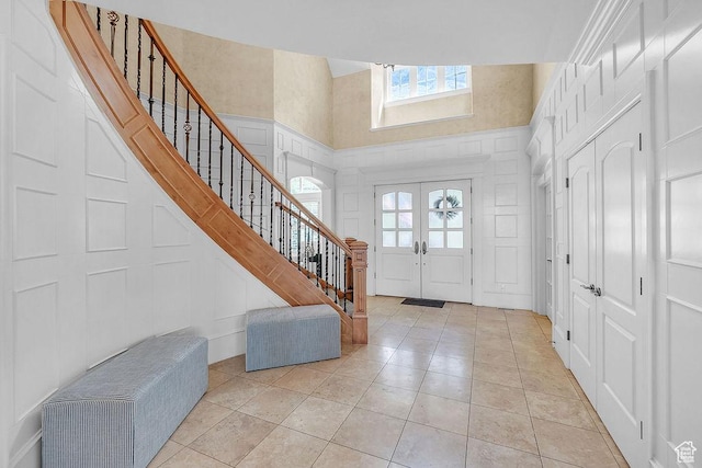 943 N Terrace Dr, Provo, UT 84604 - foyer with a skylight, a towering ceiling, stairs, and light tile patterned floors