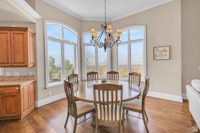 943 N Terrace Dr, Provo, UT 84604 - dining space featuring light wood finished floors, baseboards, a chandelier, and crown molding
