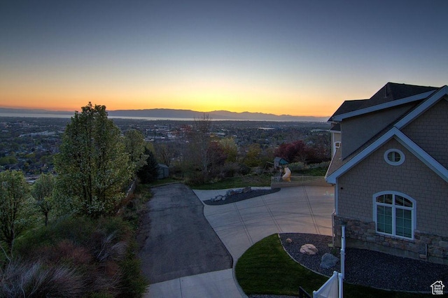 943 N Terrace Dr, Provo, UT 84604 - yard at dusk featuring a patio area, driveway, and a mountain view