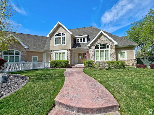 943 N Terrace Dr, Provo, UT 84604 - view of front of property with stone siding, a front lawn, fence, and a shingled roof
