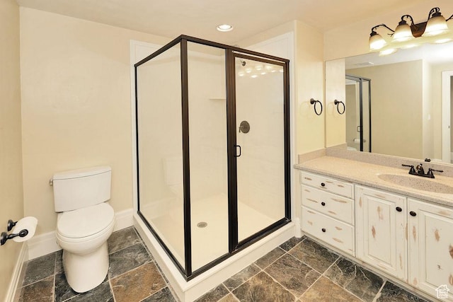 943 N Terrace Dr, Provo, UT 84604 - bathroom featuring baseboards, stone finish flooring, a shower stall, and toilet