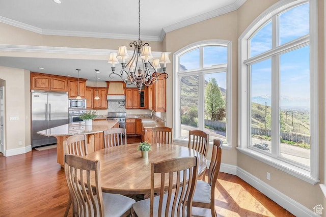 943 N Terrace Dr, Provo, UT 84604 - dining area with a notable chandelier, ornamental molding, baseboards, and dark wood-style flooring