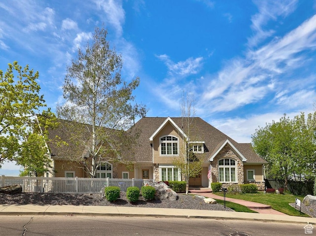 943 N Terrace Dr, Provo, UT 84604 - craftsman-style house with stone siding, a shingled roof, and a fenced front yard