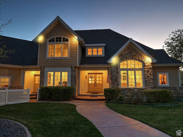 943 N Terrace Dr, Provo, UT 84604 - craftsman-style home featuring stone siding, roof with shingles, and a front yard