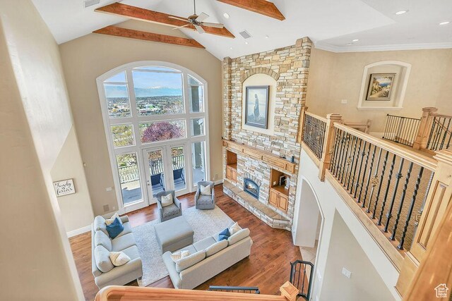 943 N Terrace Dr, Provo, UT 84604 - living room with a fireplace, wood finished floors, high vaulted ceiling, and ceiling fan
