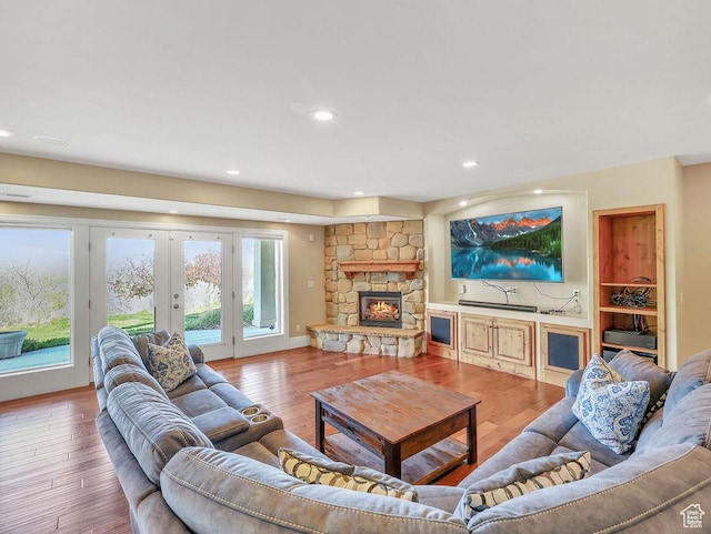 943 N Terrace Dr, Provo, UT 84604 - living room featuring recessed lighting, wood finished floors, a wealth of natural light, and a fireplace