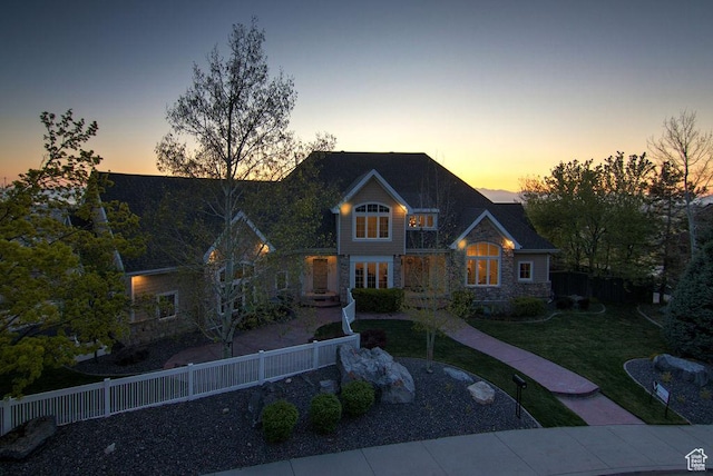 943 N Terrace Dr, Provo, UT 84604 - view of front of house with stone siding, fence private yard, and a yard