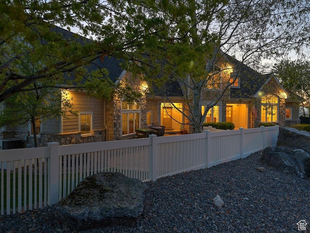 943 N Terrace Dr, Provo, UT 84604 - rear view of property featuring stone siding and a fenced front yard