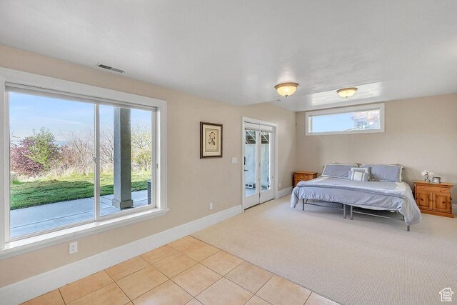 943 N Terrace Dr, Provo, UT 84604 - bedroom with light tile patterned floors, light carpet, visible vents, and baseboards
