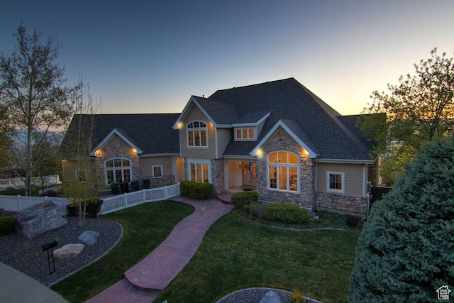943 N Terrace Dr, Provo, UT 84604 - craftsman house featuring a yard, fence, stone siding, and a shingled roof