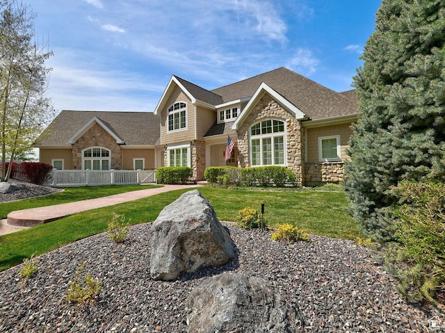 943 N Terrace Dr, Provo, UT 84604 - view of front of property with a front lawn, fence, stone siding, and a shingled roof