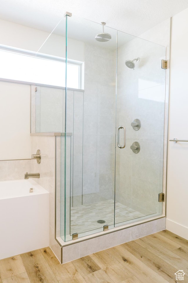 178 W Autumn Ln Unit 136, Saratoga Springs, UT 84045 - full bathroom with a shower stall, wood finished floors, and a garden tub