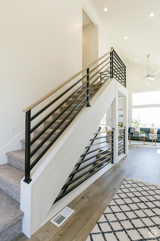 178 W Autumn Ln Unit 136, Saratoga Springs, UT 84045 - stairs featuring visible vents, a high ceiling, ceiling fan, recessed lighting, and wood-type flooring