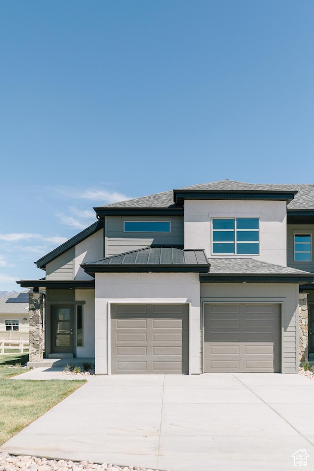 178 W Autumn Ln Unit 136, Saratoga Springs, UT 84045 - prairie-style house featuring a standing seam roof, a garage, driveway, and roof mounted solar panels