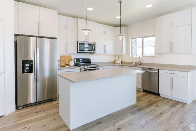 178 W Autumn Ln Unit 136, Saratoga Springs, UT 84045 - kitchen with stainless steel appliances, recessed lighting, light wood finished floors, and a sink