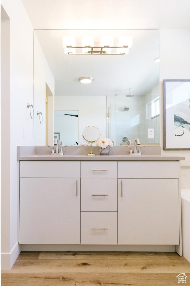 178 W Autumn Ln Unit 136, Saratoga Springs, UT 84045 - full bath featuring double vanity, a sink, and wood finished floors