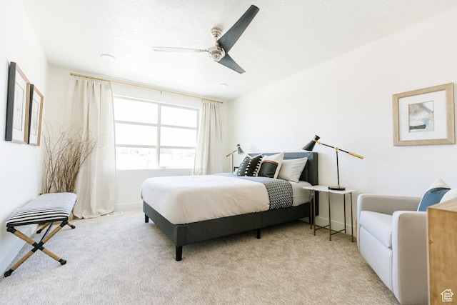 178 W Autumn Ln Unit 136, Saratoga Springs, UT 84045 - bedroom featuring baseboards, a ceiling fan, and light colored carpet