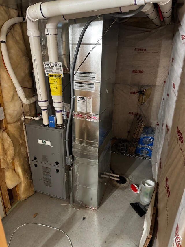 utility room with heating unit