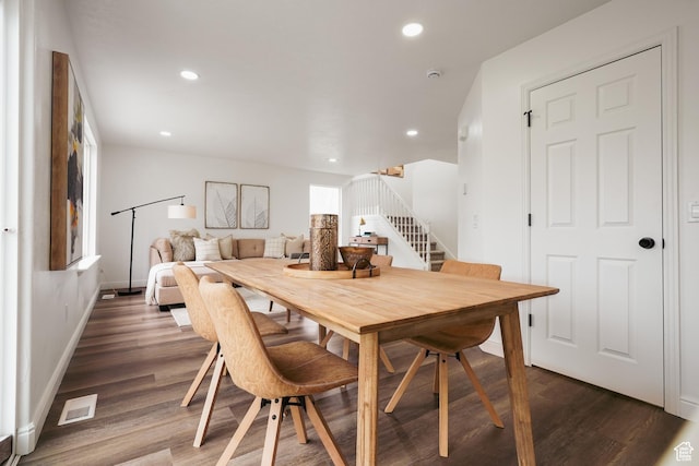 dining room featuring recessed lighting, stairway, wood finished floors, visible vents, and baseboards
