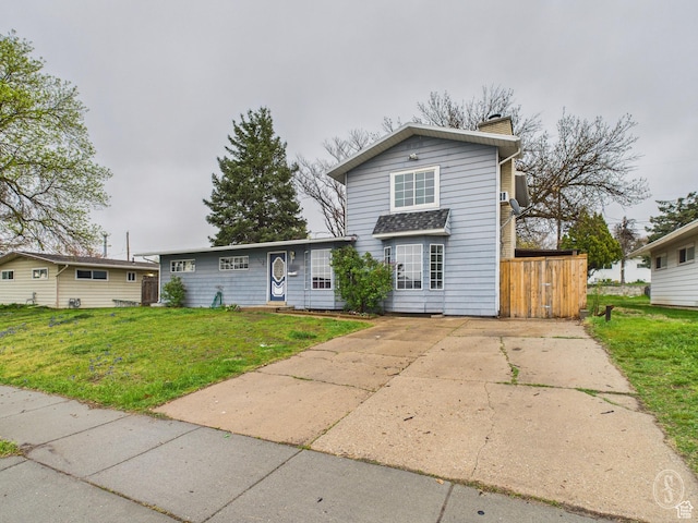 1534 N 300 W, Sunset, UT 84015 - traditional-style home featuring a chimney and a front yard