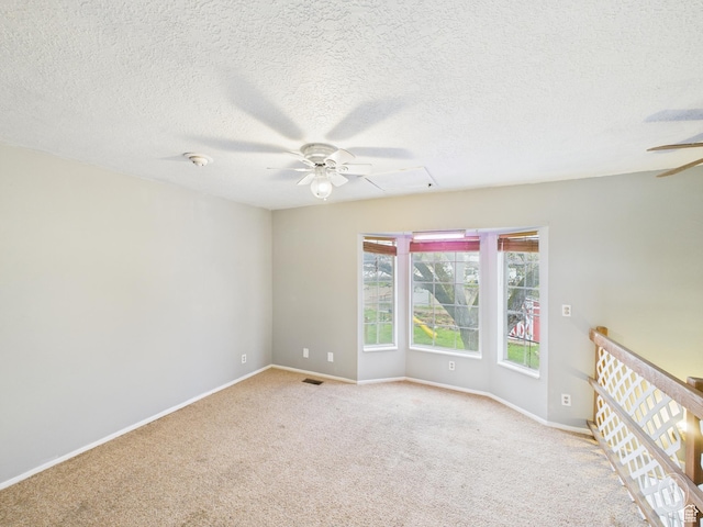 1534 N 300 W, Sunset, UT 84015 - unfurnished room featuring a textured ceiling, ceiling fan, baseboards, carpet flooring, and visible vents