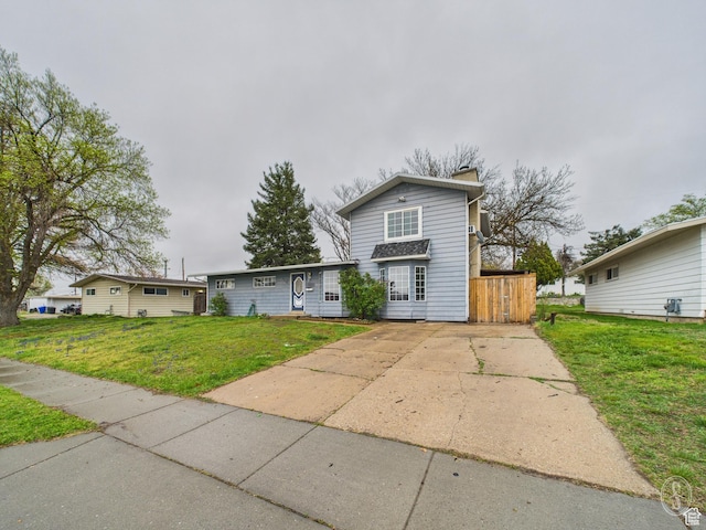 1534 N 300 W, Sunset, UT 84015 - traditional home featuring a front yard and a chimney