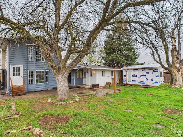 1534 N 300 W, Sunset, UT 84015 - view of front of home featuring an outbuilding, entry steps, and a front yard