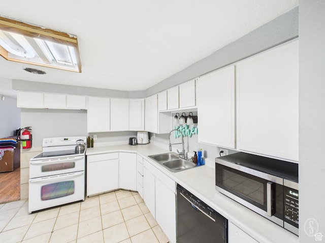 1534 N 300 W, Sunset, UT 84015 - kitchen with a sink, double oven range, light countertops, stainless steel microwave, and black dishwasher