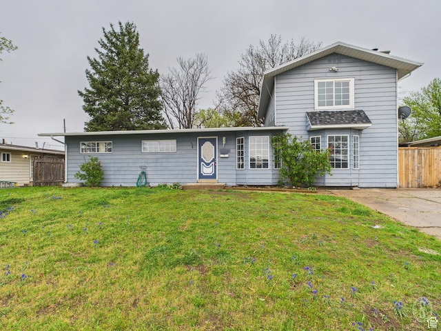 1534 N 300 W, Sunset, UT 84015 - traditional-style house with fence and a front yard