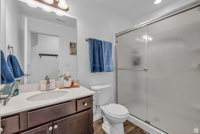 14714 S Rising Star Way, Bluffdale, UT 84065 - bathroom with wood finished floors, a stall shower, vanity, toilet, and visible vents