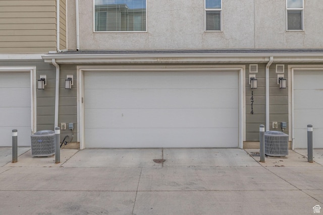 14714 S Rising Star Way, Bluffdale, UT 84065 - garage with central AC unit and driveway