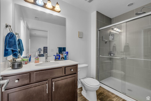 14714 S Rising Star Way, Bluffdale, UT 84065 - full bathroom with toilet, visible vents, wood finished floors, a shower stall, and vanity