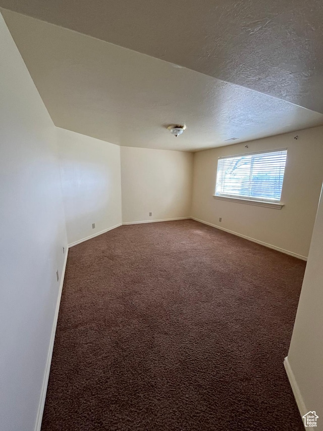 407 W Larkspur Ln, Morgan, UT 84050 - carpeted spare room featuring a textured ceiling and baseboards