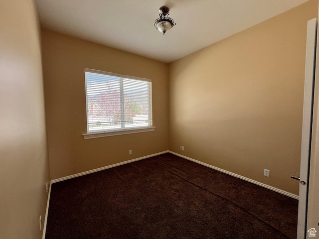407 W Larkspur Ln, Morgan, UT 84050 - empty room with dark carpet and baseboards