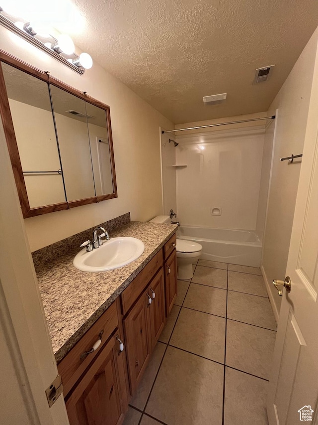 407 W Larkspur Ln, Morgan, UT 84050 - bathroom with toilet, tile patterned flooring, a textured ceiling, and visible vents